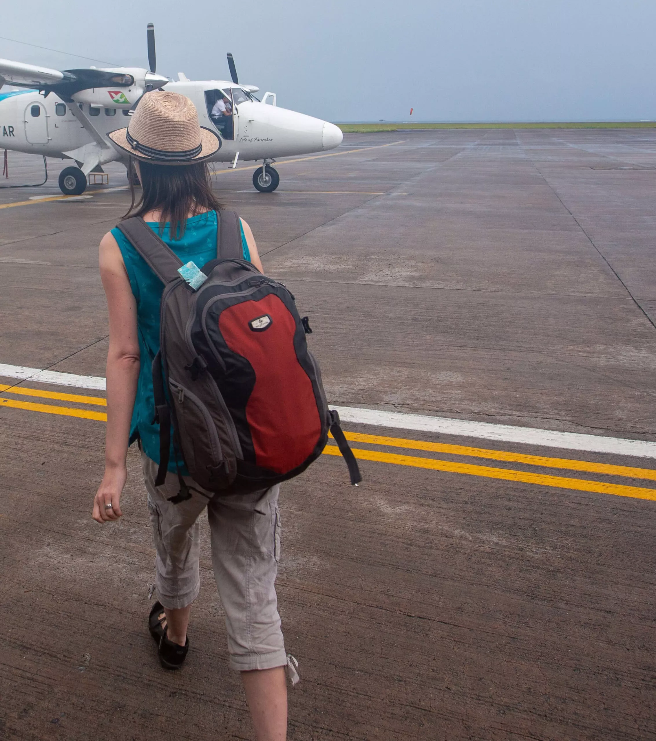Eagle Creek daypack worn walking to a Twin Otter in the Seychelles