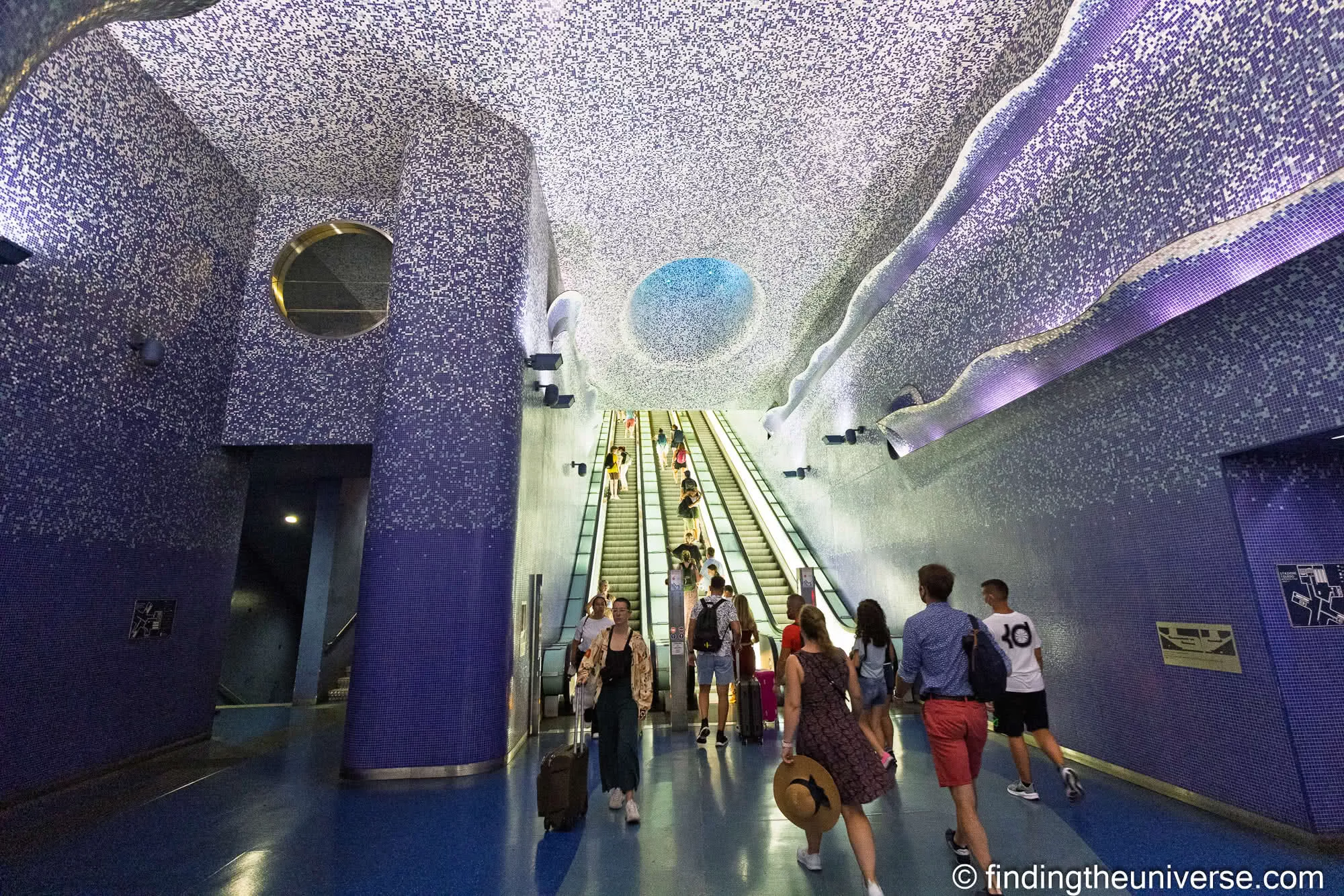 The blue mosaic escalator shaft at Toledo metro station in Naples