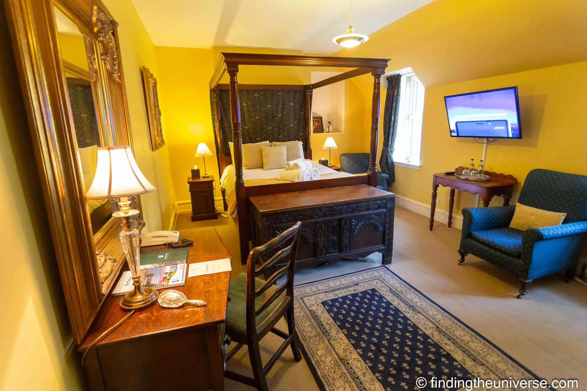A four-poster room at Dalmunzie Castle Hotel