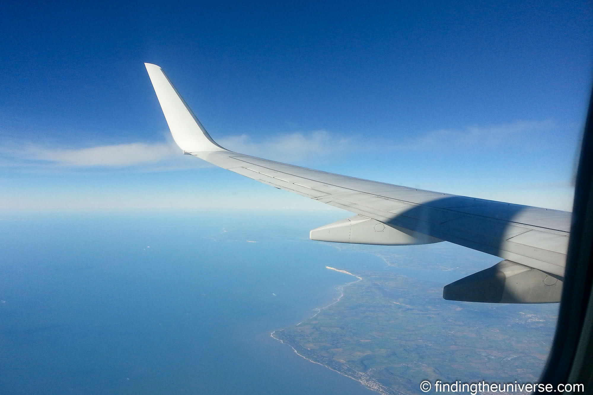 Airplane window view by Laurence Norah
