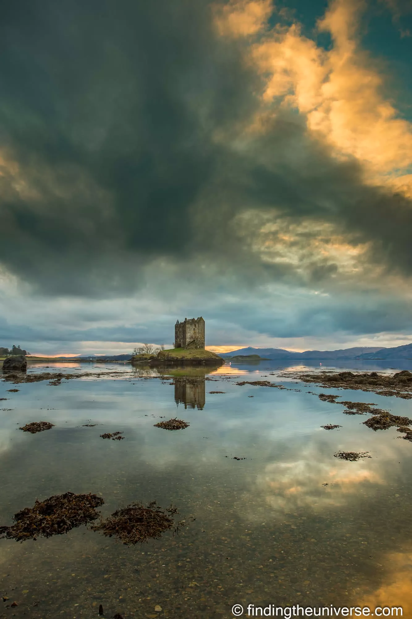 Castle Stalker at dusk on a still tide
