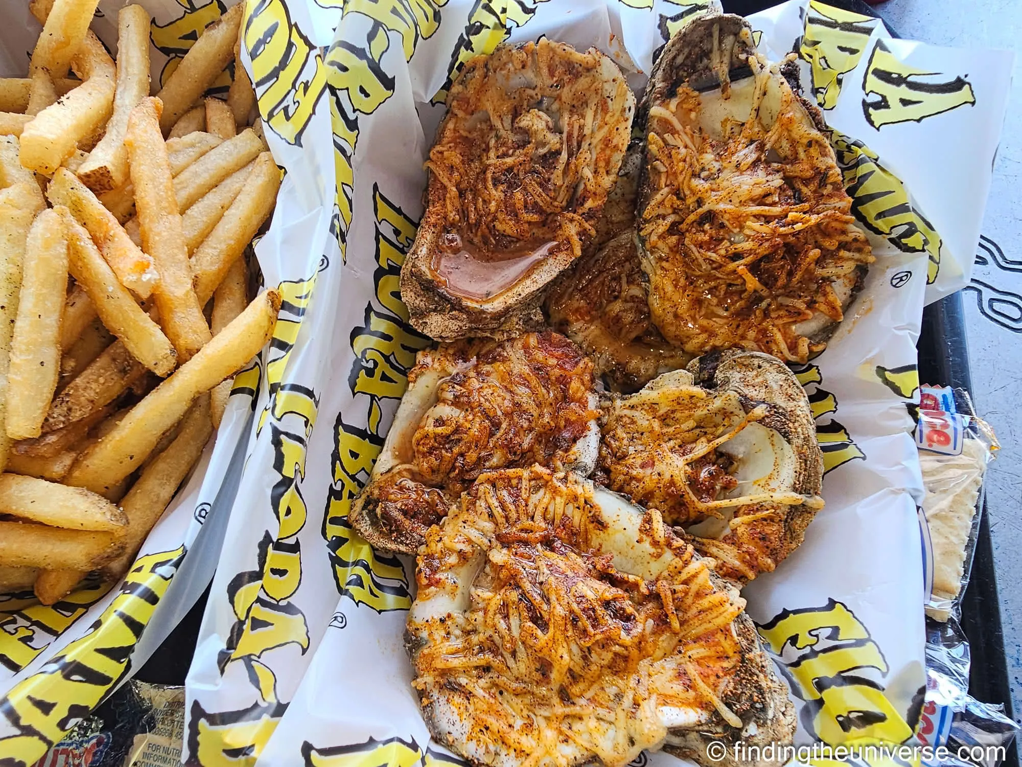 Chargrilled oysters and fries at the Flora-Bama by Laurence Norah