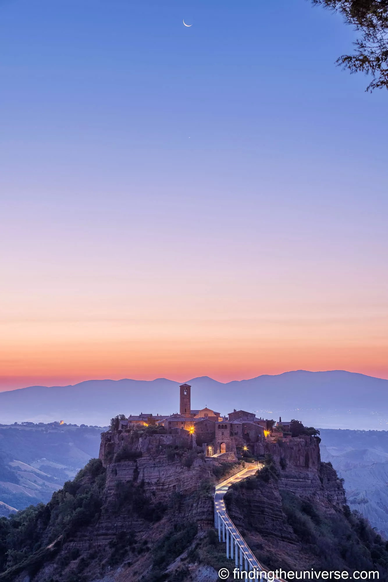 Dawn and a crescent moon over Civita di Bagnoregio