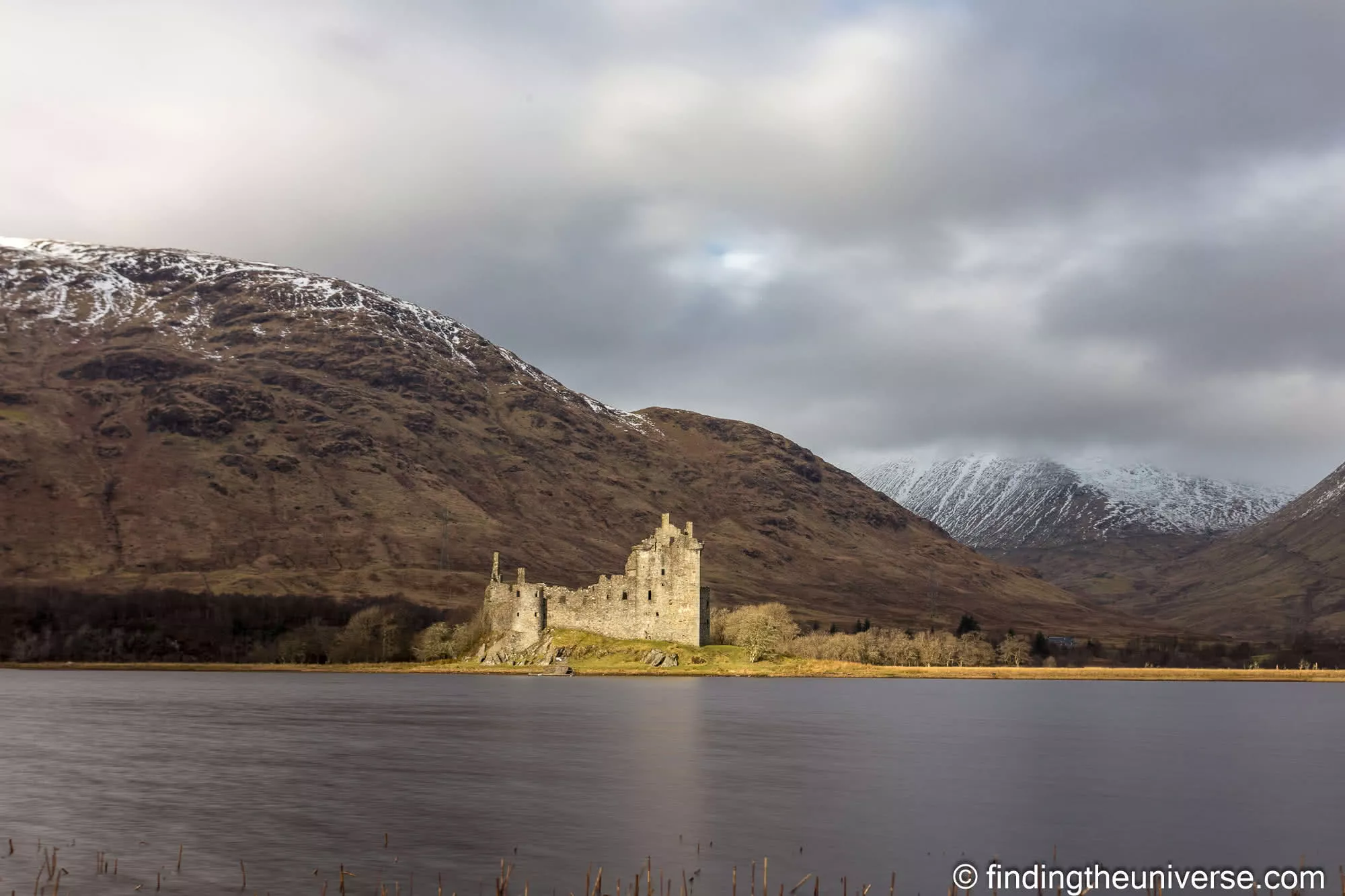 Kilchurn Castle across a still Loch Awe