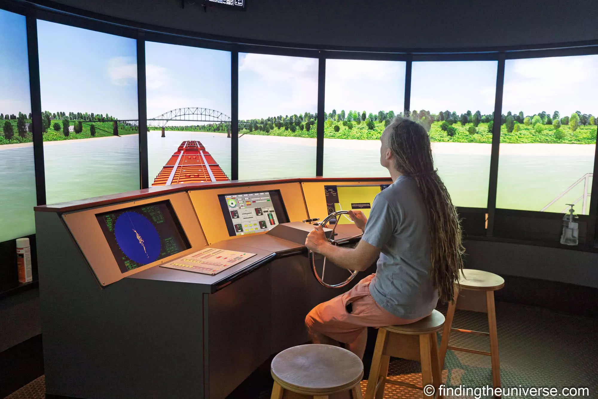 Laurence at the helm in the ship simulator at the National Maritime Museum of the Gulf