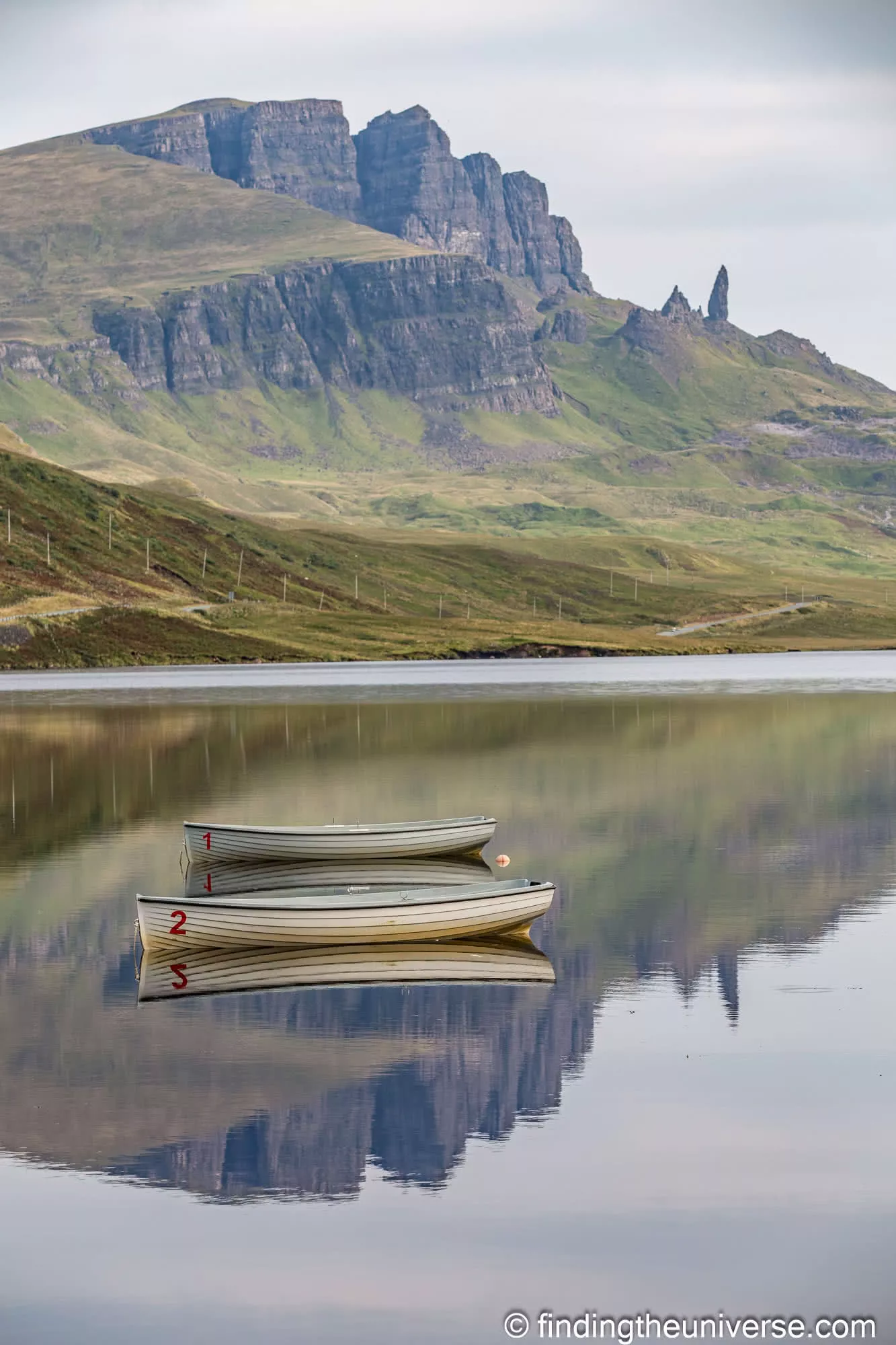The Old Man of Storr reflected in the still water of Loch Fada on the Isle of Skye