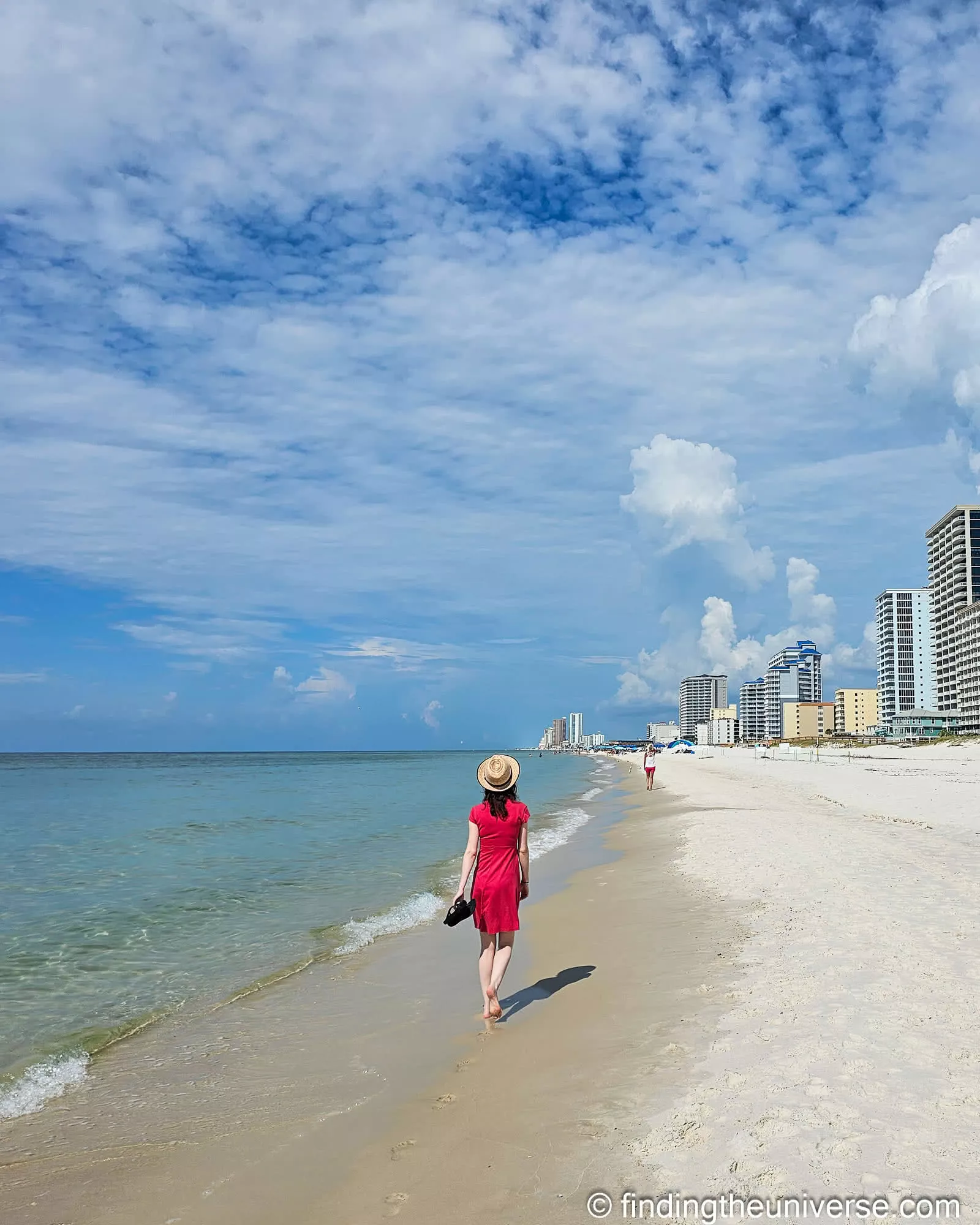 Walking the Gulf Shores shoreline towards the condo strip