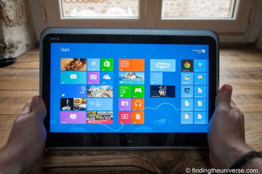 Windows tablet held in hands for photo editing