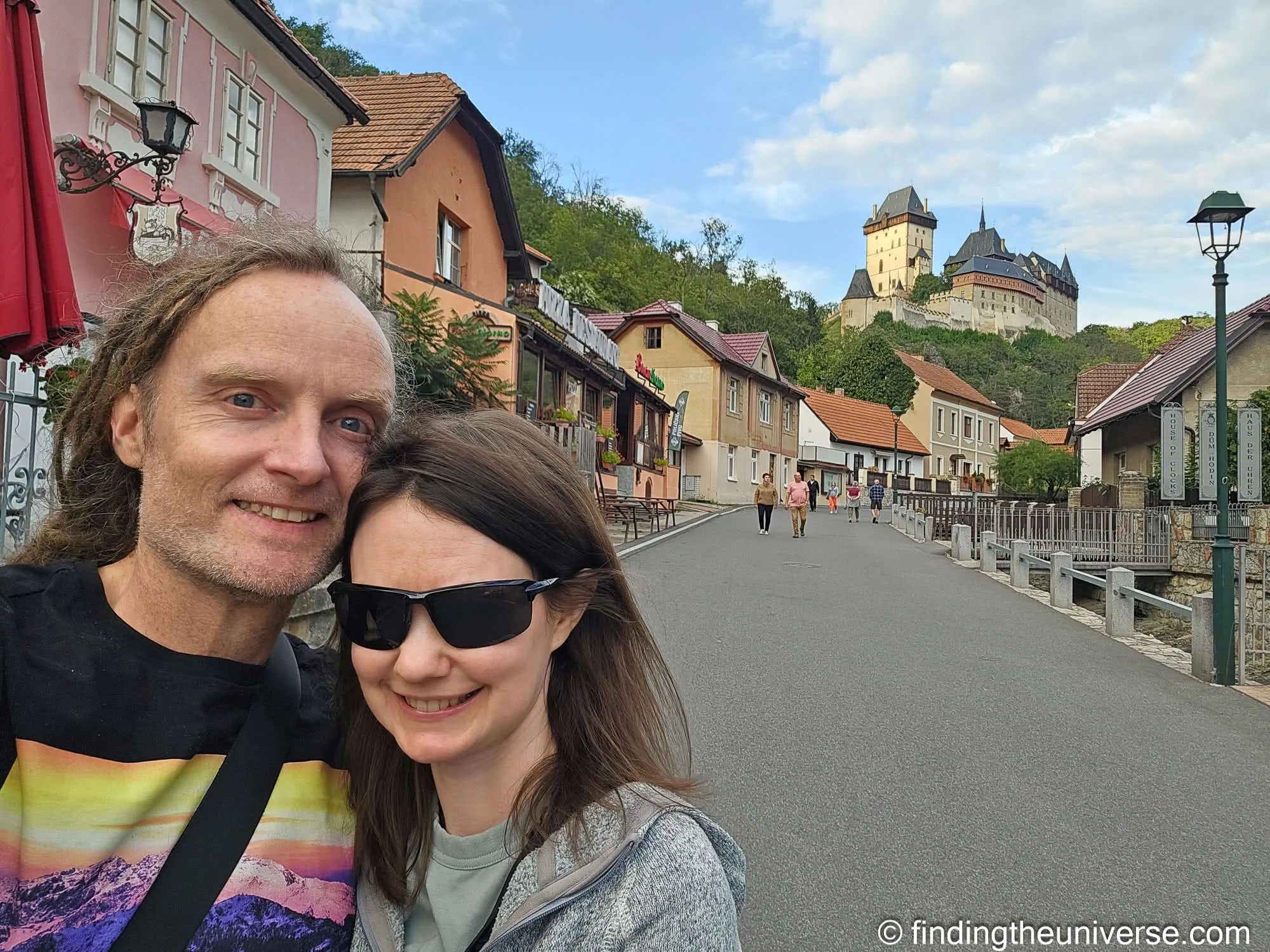 Laurence and Jessica in Karlštejn village with the castle behind