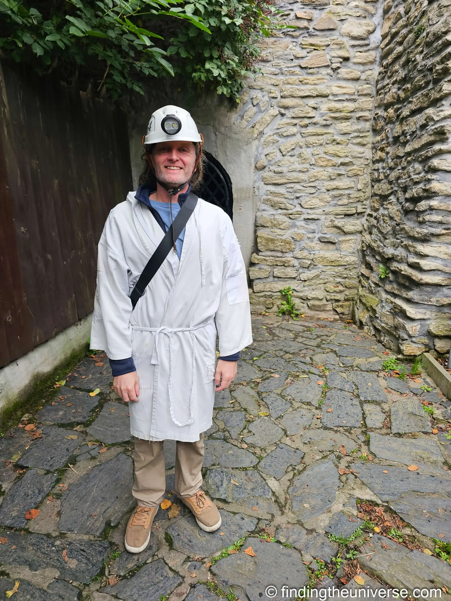 Laurence in the helmet and white coat for the silver mine tour, Kutná Hora