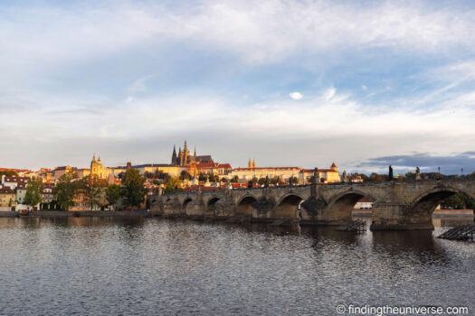 Charles Bridge and Prague Castle at dawn across the Vltava