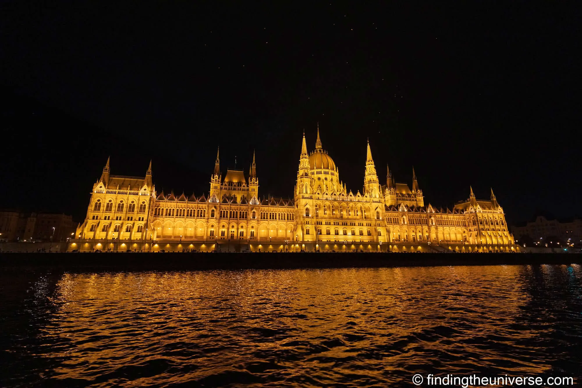 Hungarian Parliament lit up at night from a Danube cruise