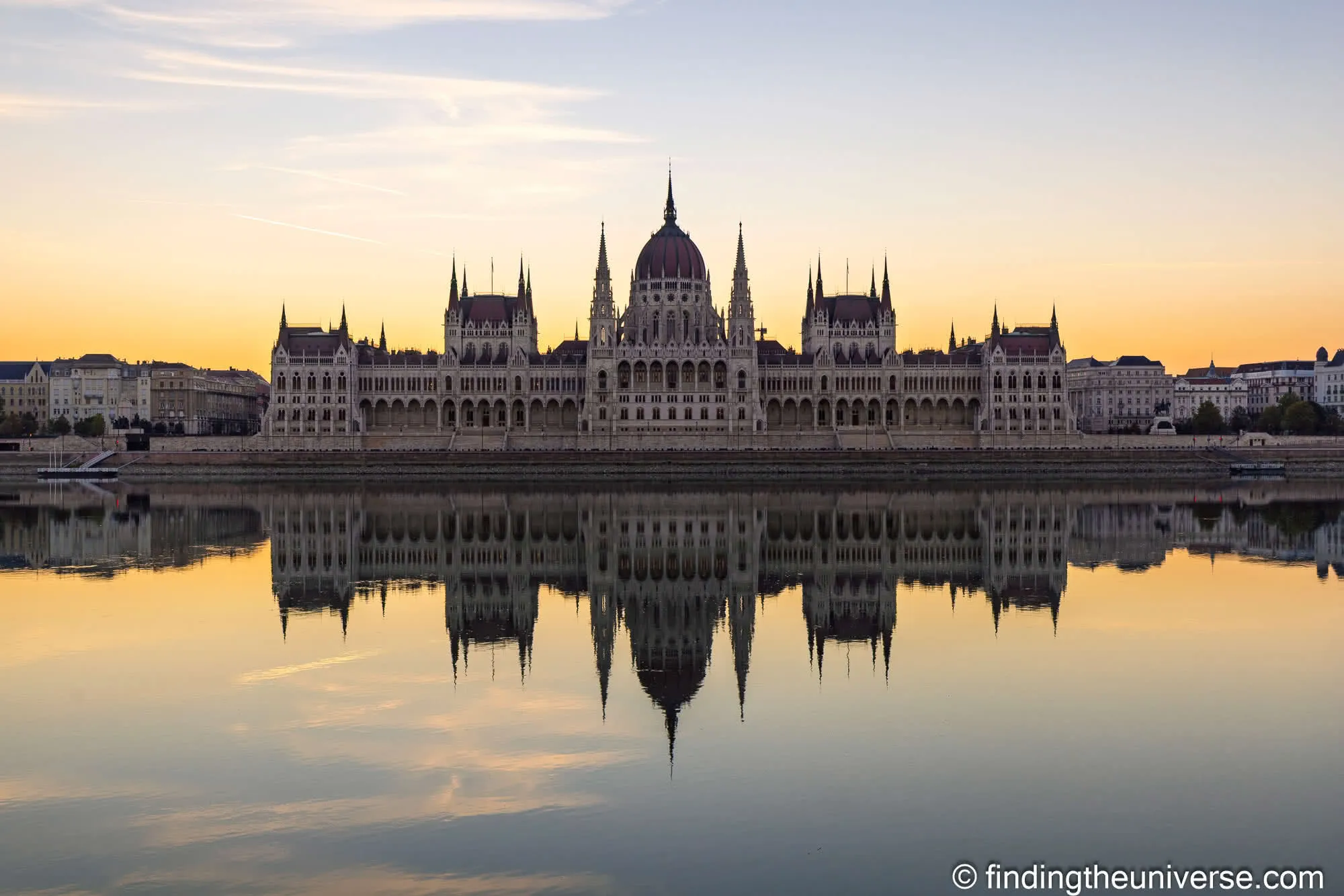 Hungarian Parliament reflected in the Danube at sunrise