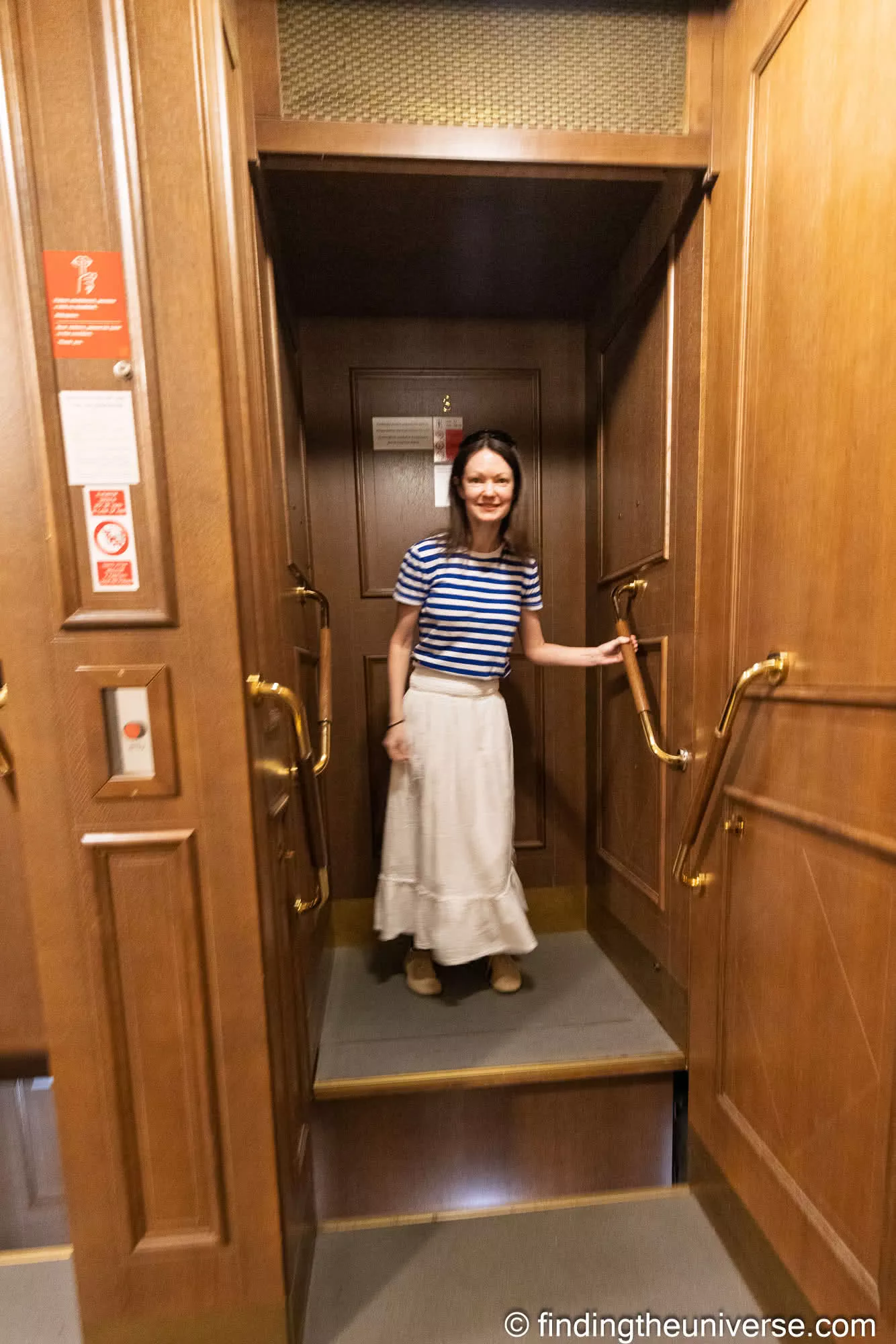 Jess riding the paternoster at Prague City Hall