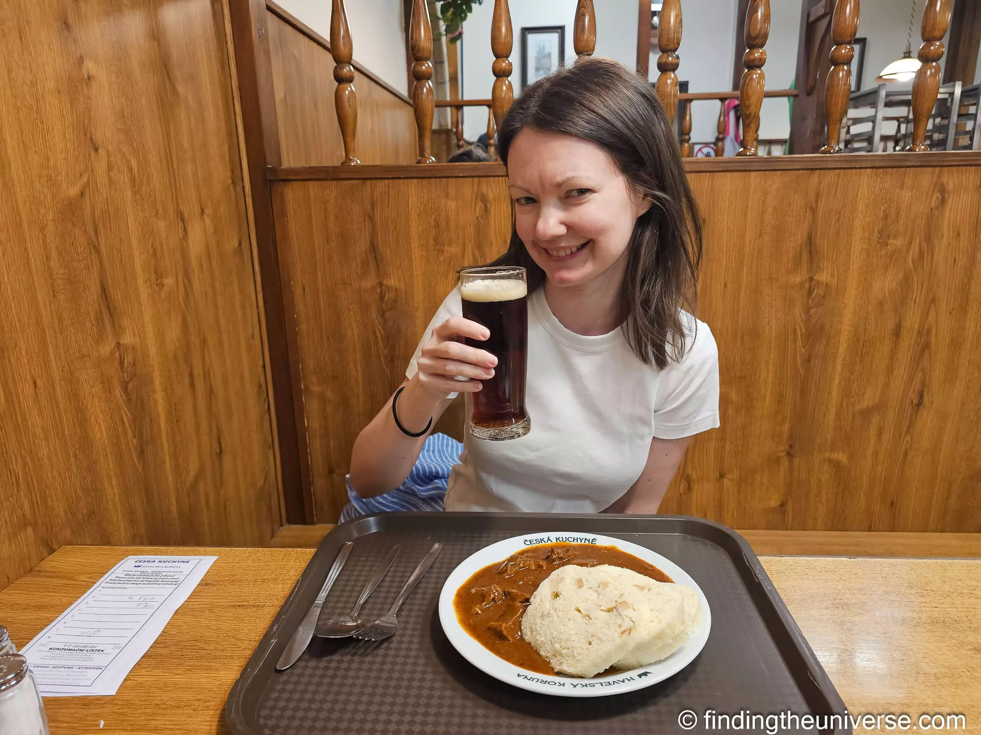 Jess with a dark beer and goulash at Havelská Koruna, Prague
