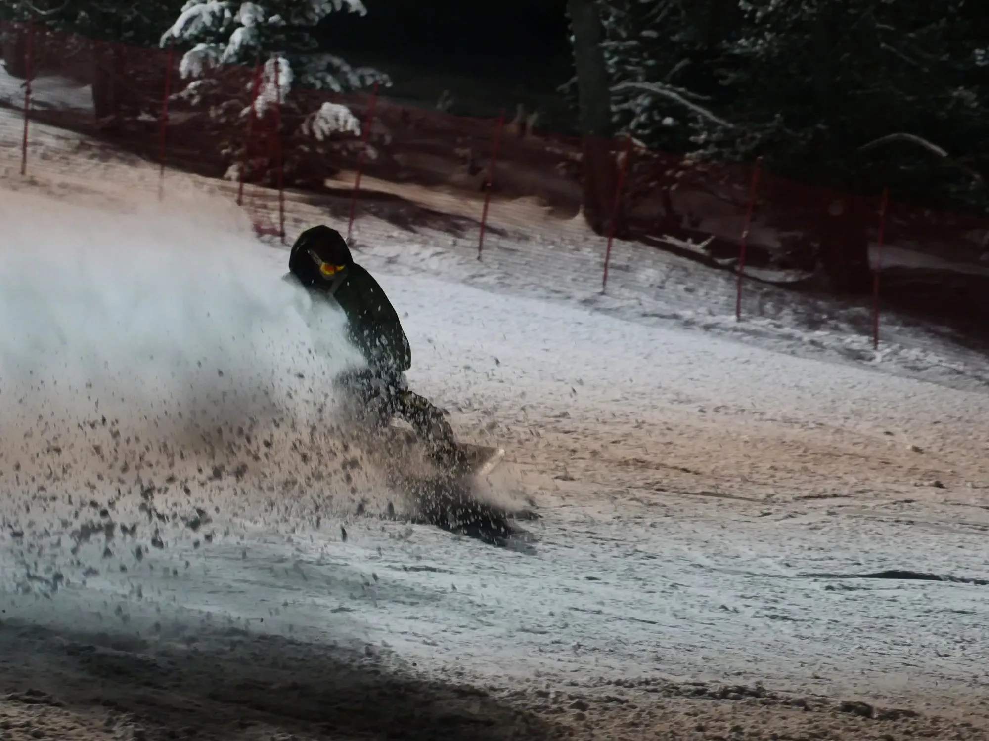 Snowboarder kicking up spray in the Spanish Pyrenees
